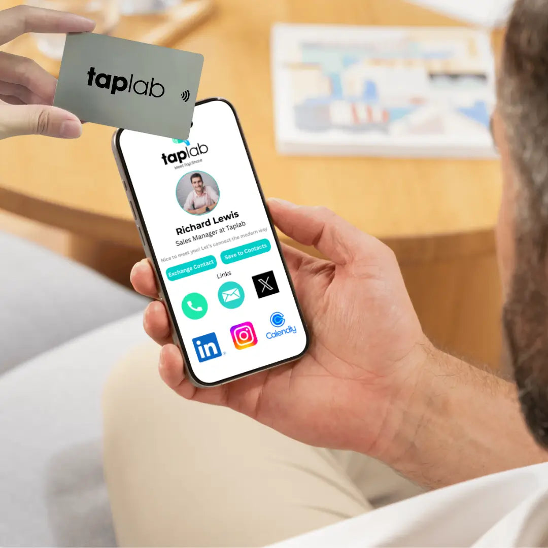 Tapping an NFC business card on a smartphone to share contact details